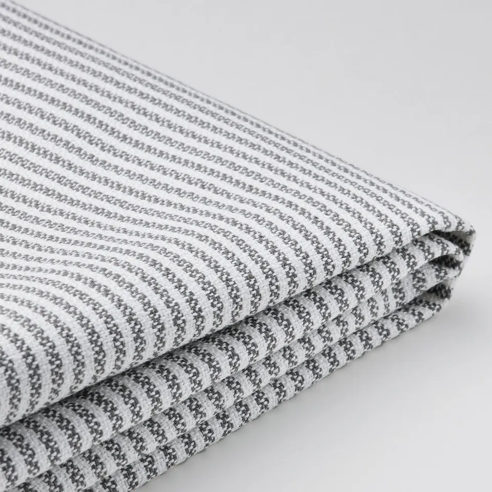 Stylish, striped fabric with intricate texture, folded neatly.