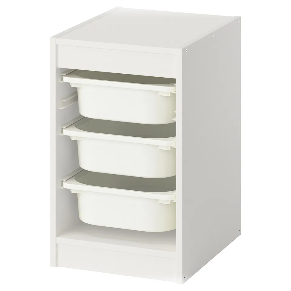 White TROFAST storage unit with four green-lined bins, stackable, wooden frame, plastic boxes, rectangular shape.