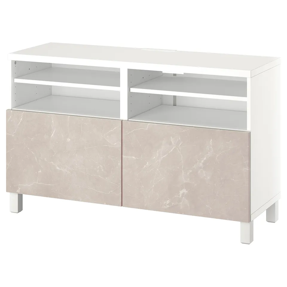 A white and beige BESTÅ tv bench with open shelves. The lower part has marble-patterned doors. Its modern, rectangular, and has adjustable shelves.