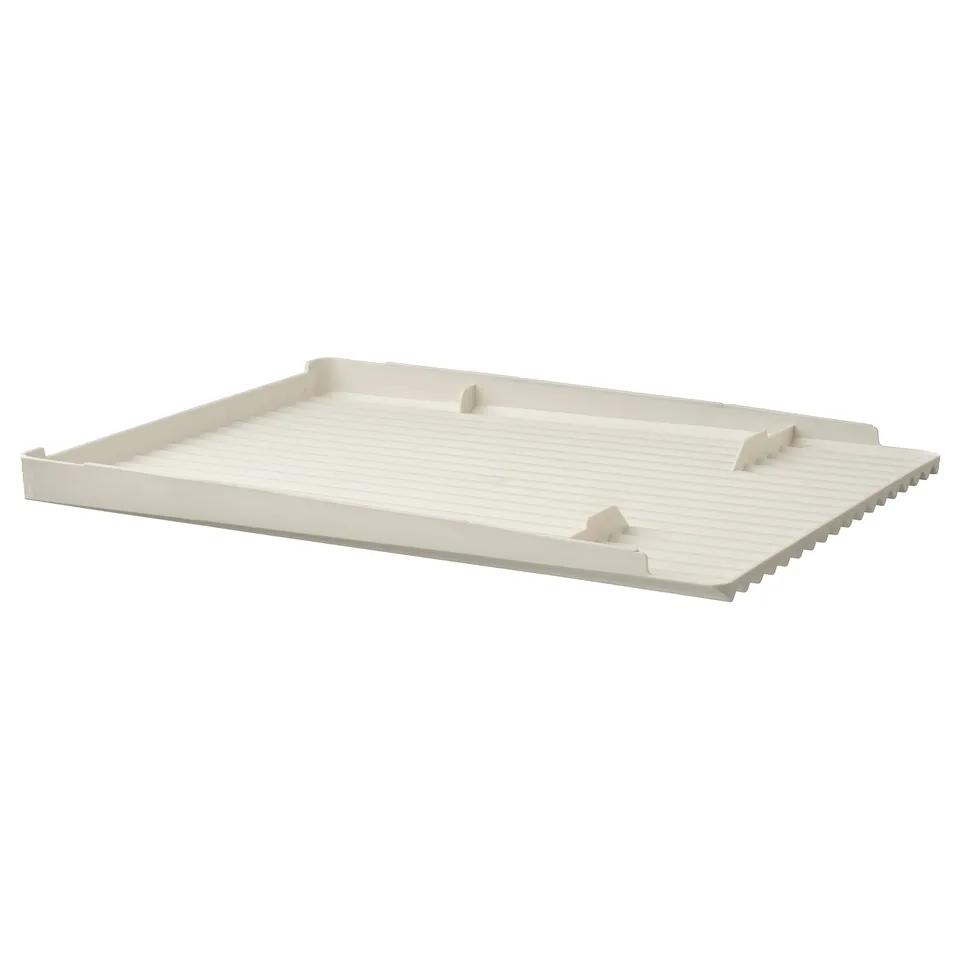A white RINNIG dish drainer made of polypropylene plastic, rectangular with triangular feet.