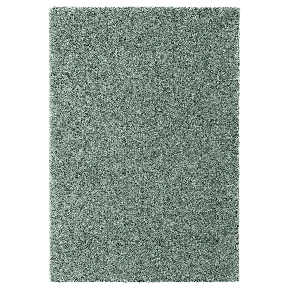 A light green, rectangular STOENSE rug with a soft, low pile and slight sheen, ideal for living or bedrooms.