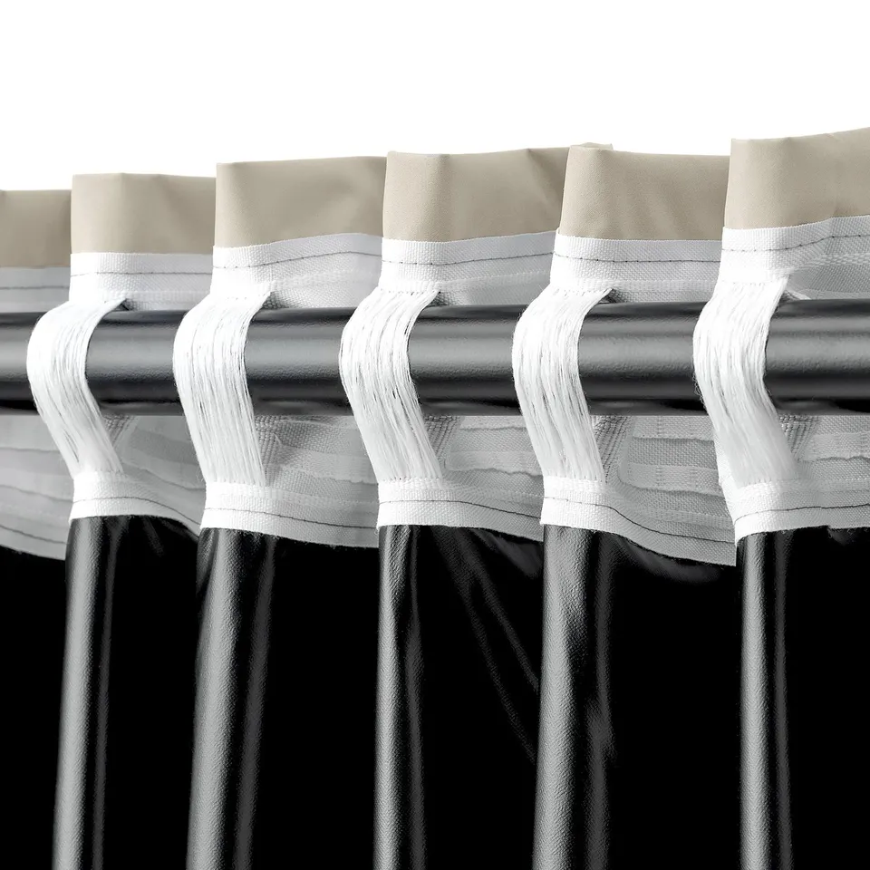 Curtains with looped rod pockets for easy hanging, made from light-blocking fabric.