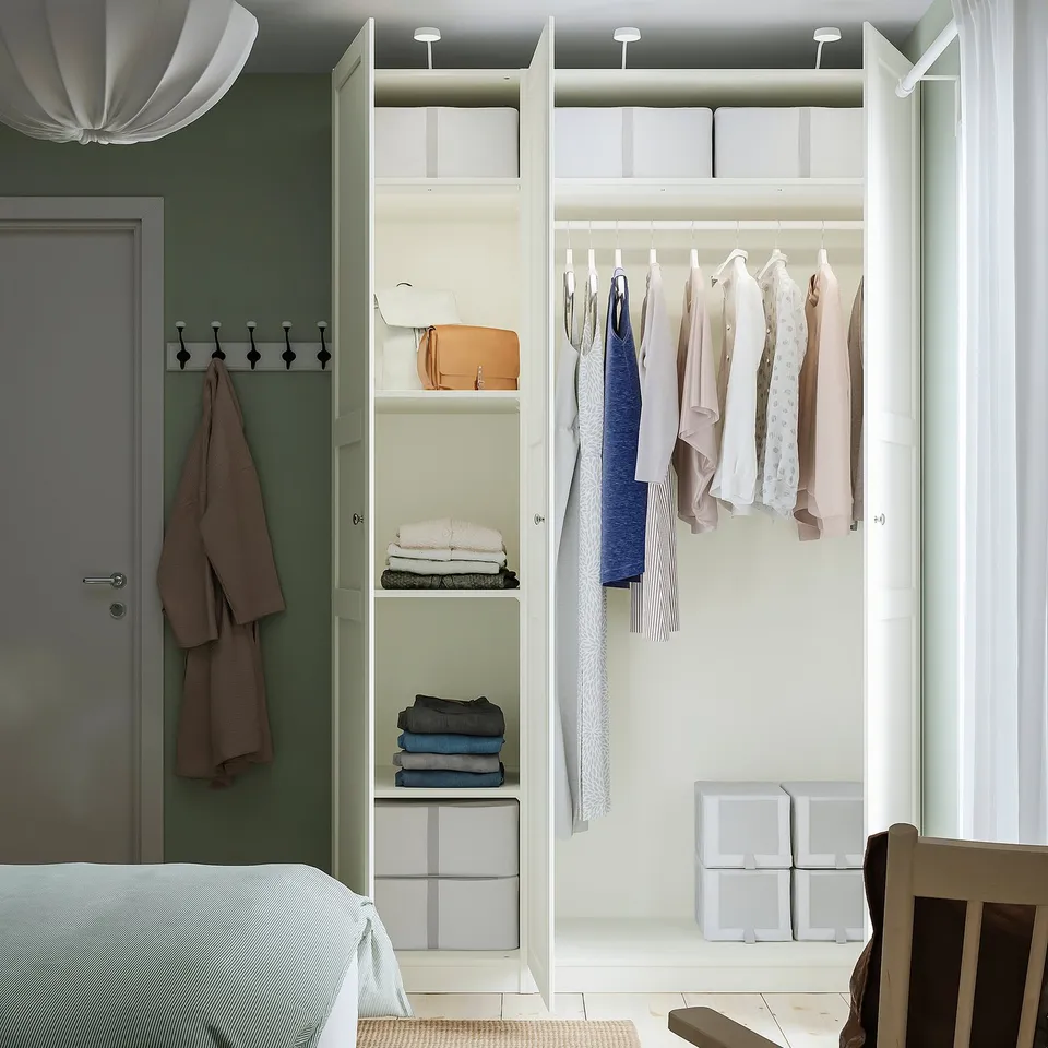 Modern closet with clothes, shelves, and boxes. Holds about 40 shirts. Soft-closing hinges.