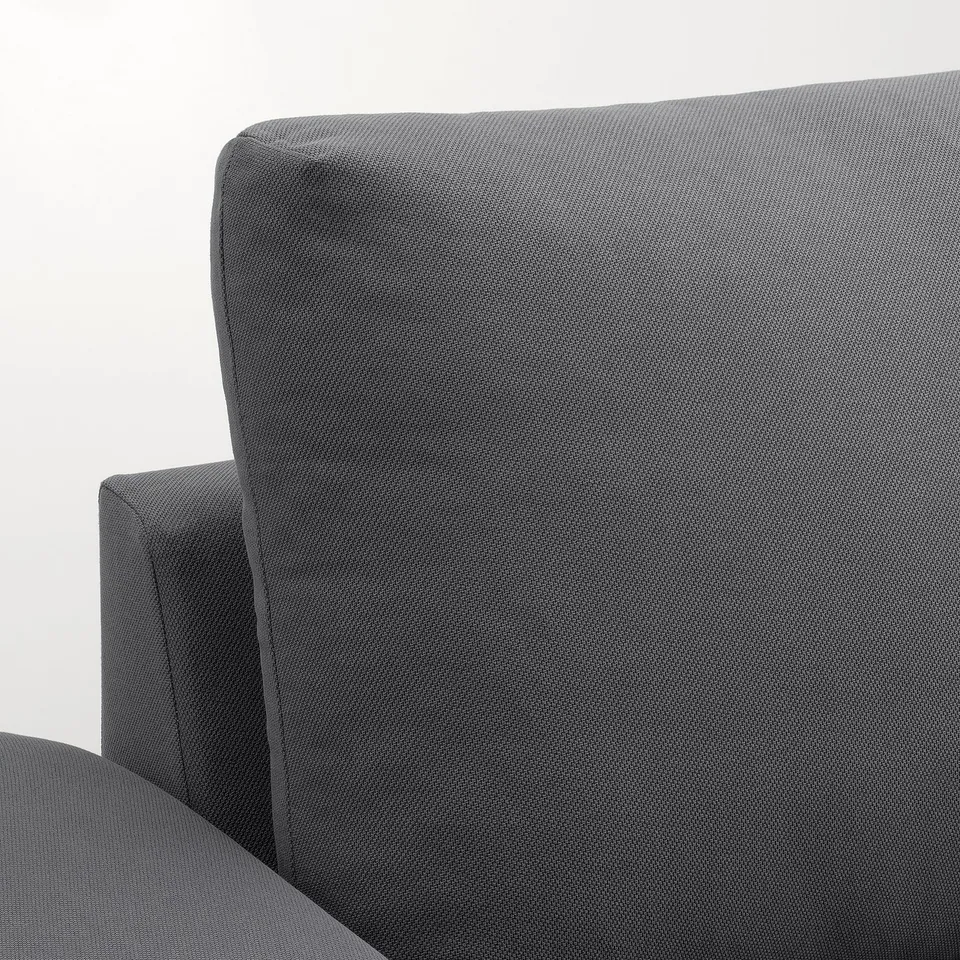 Close-up of VIMLE sectional sofas clean, modern grey fabric and sturdy design.