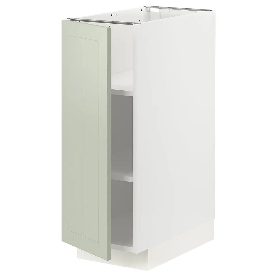 A white METOD kitchen cabinet with a green stensund door. Its rectangular with adjustable shelves and a sleek, modern design.