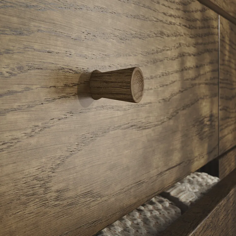 Wooden hook on aged, textured wood surface; natural, rustic appearance.