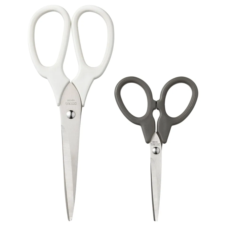 Two scissors sets: MÄRKBART, one white, one grey, stainless steel blades, ergonomic handles.