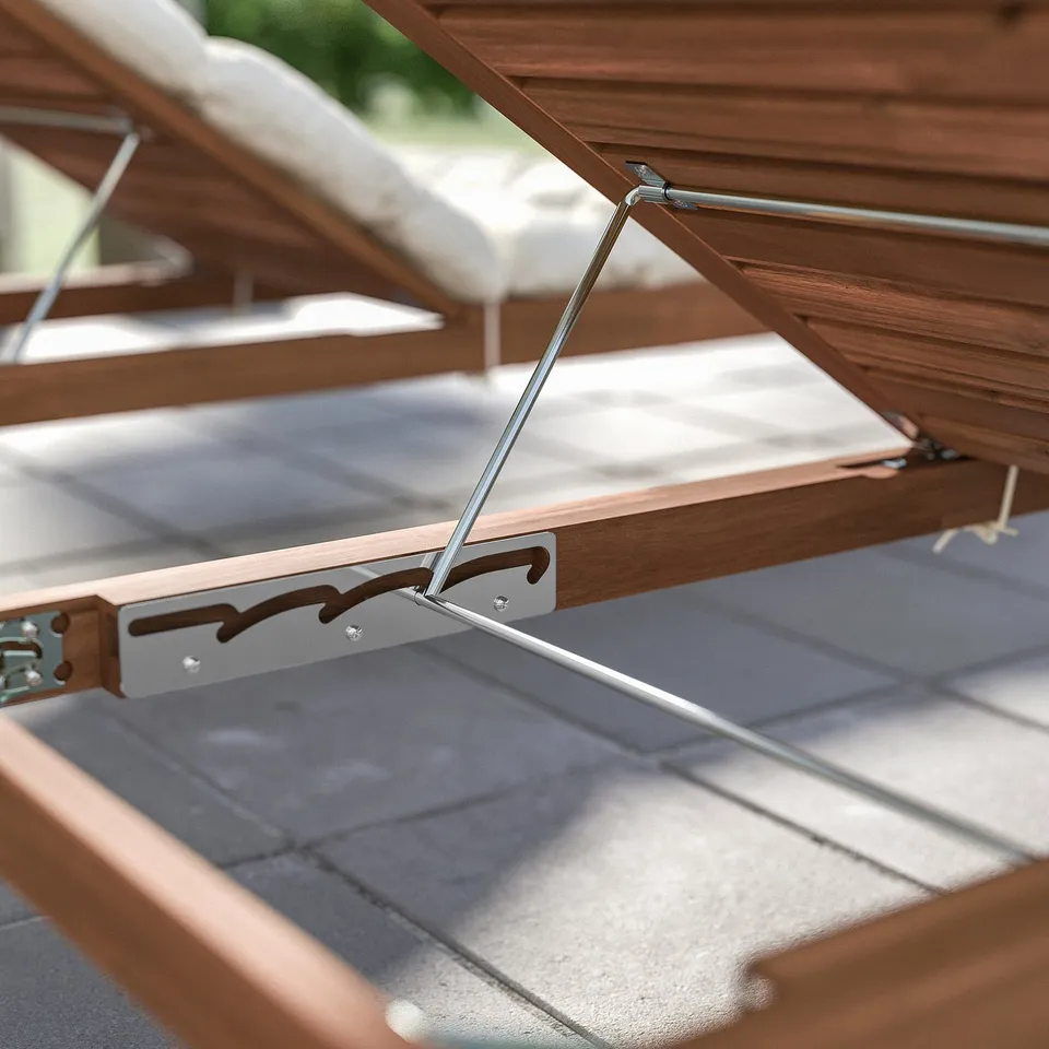 Brown acacia wood and metal outdoor furniture.