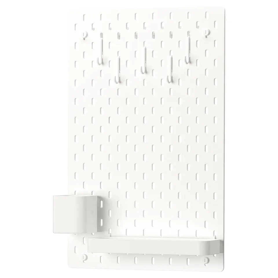 SKÅDIS white pegboard with hooks and shelf, wall-mounted storage.