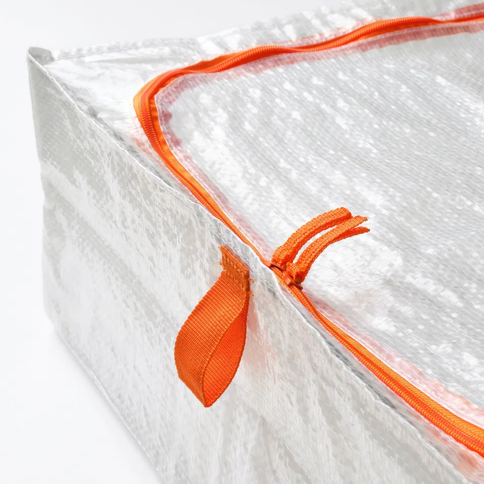 Close-up a white storage bag with bright orange zip and handles, showing high-quality design and durable zippers.