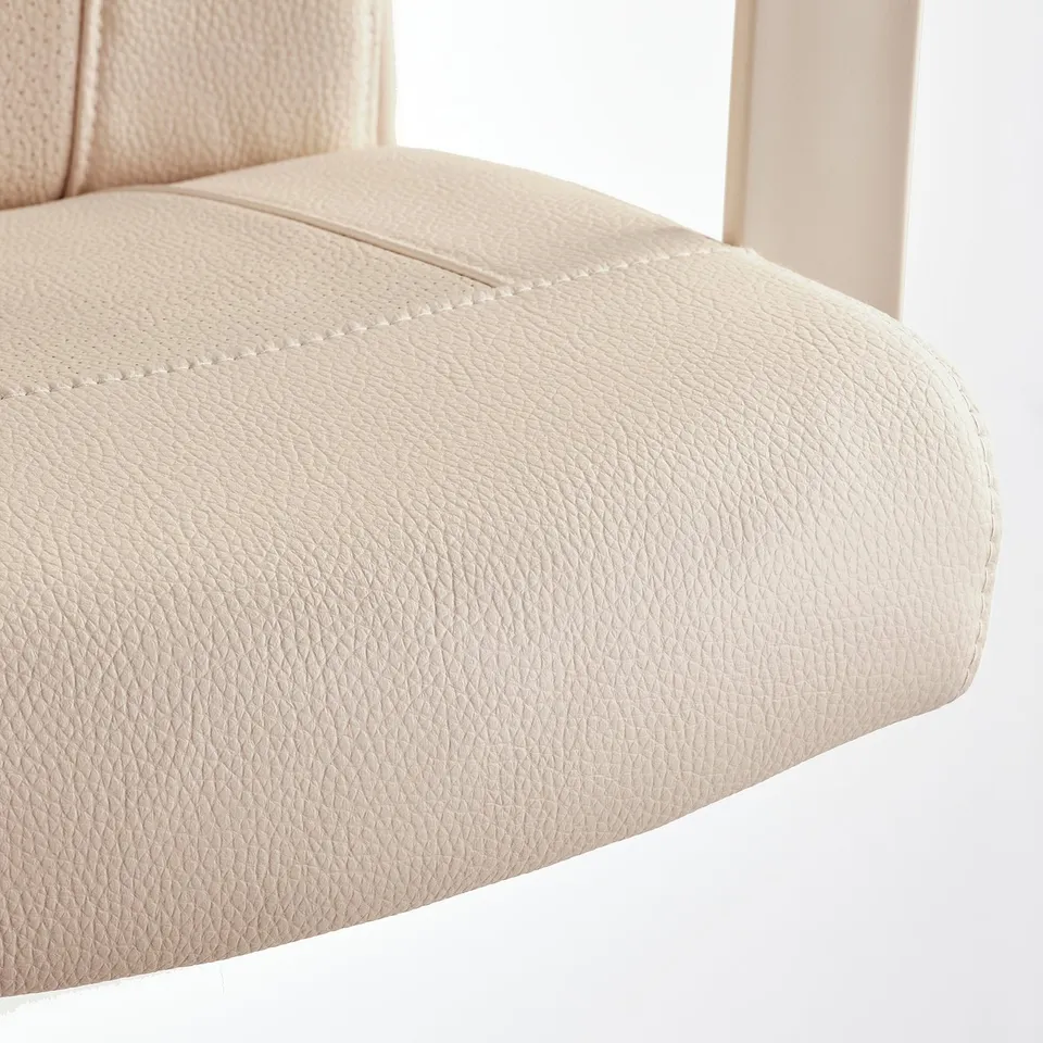 Light-colored chair with textured, cushioned seat and backrest. Armrests are visible, and seams are neatly stitched, indicating quality craftsmanship.