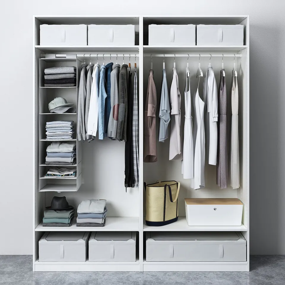 PAX wardrobe with organised shelves, clothes, and storage bins.