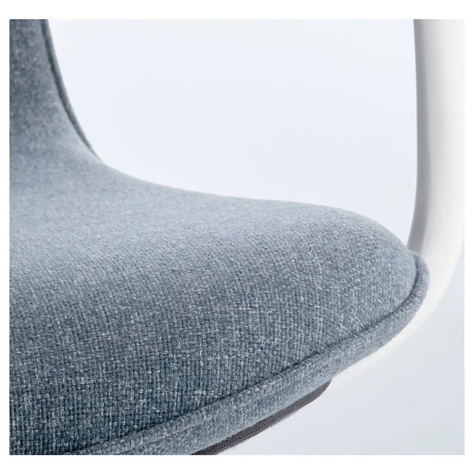 Close-up of modern office chairs padded seat edge, showcasing soft, high-quality upholstery with neat stitching.