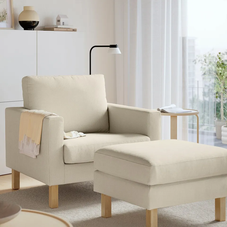 SALTSJÖBADEN footstool: cream, wood, square, compact. Joins armchair, fits small spaces.