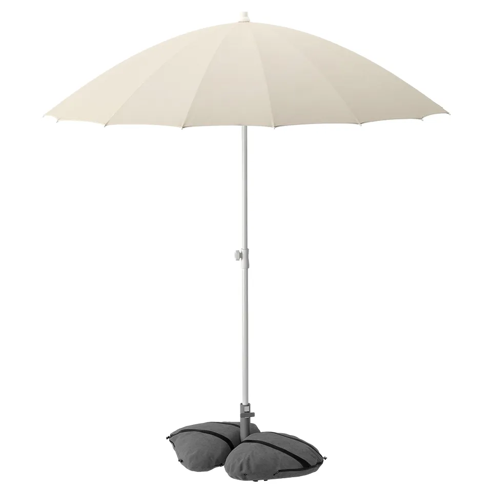 Beige outdoor umbrella with grey weighted base. Steel pole, polyester fabric, dome-shaped.