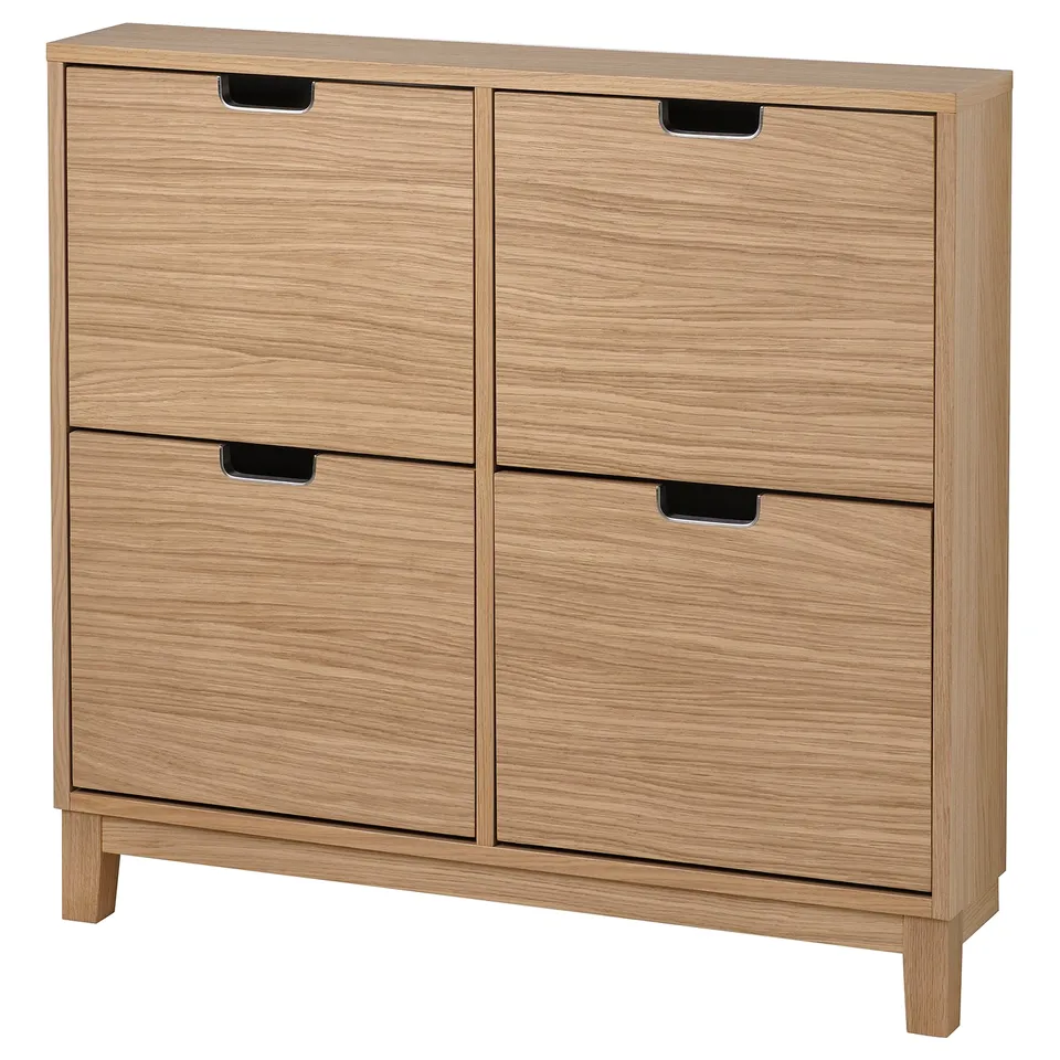 Wooden STÄLL shoe cabinet in natural oak with four sections, rectangular shape, and metal-edged handles. Efficient and stylish for organised storage.