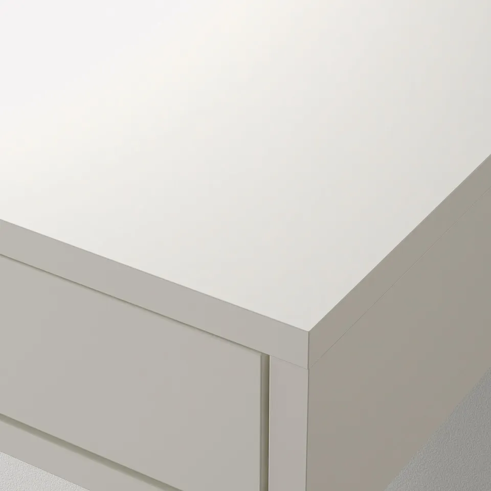 White wall-mounted unit with drawer partially open, showing high-quality, smooth finish and precise craftsmanship.