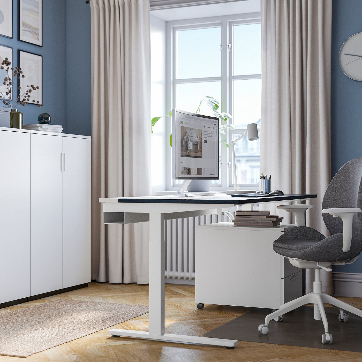 Modern home office with adjustable desk, window, chair, & minimal decor.