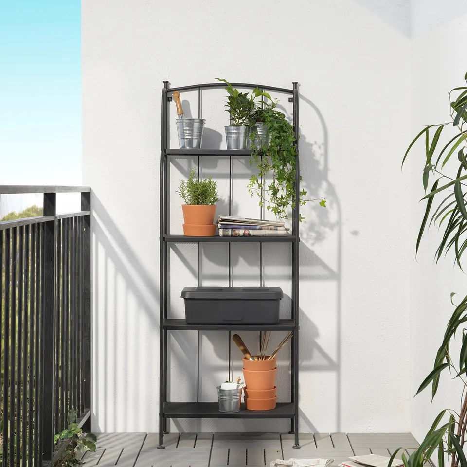 LÄCKÖ black metal plant shelf, tall, sturdy, holds potted plants & tools.