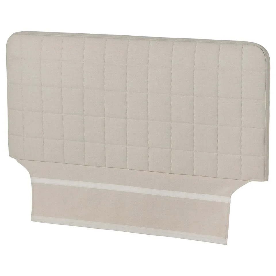 A SLÄKT headboard in beige, rectangular with quilted design.