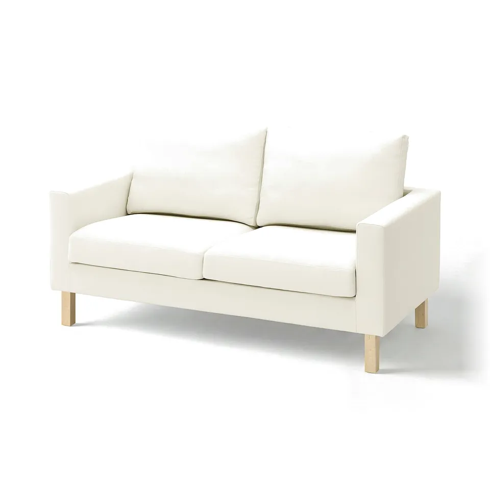 A white SALTSJÖBADEN sofa with light wood legs, offering a clean and modern look.