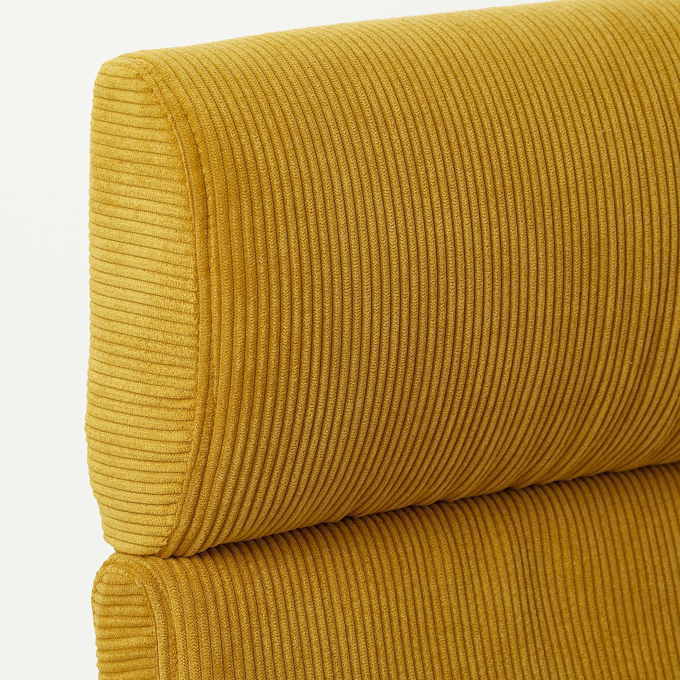 Mustard yellow POÄNG armchair, textured with fine horizontal ribs, looks plush and inviting. Soft, comfortable, and supportive for relaxation.