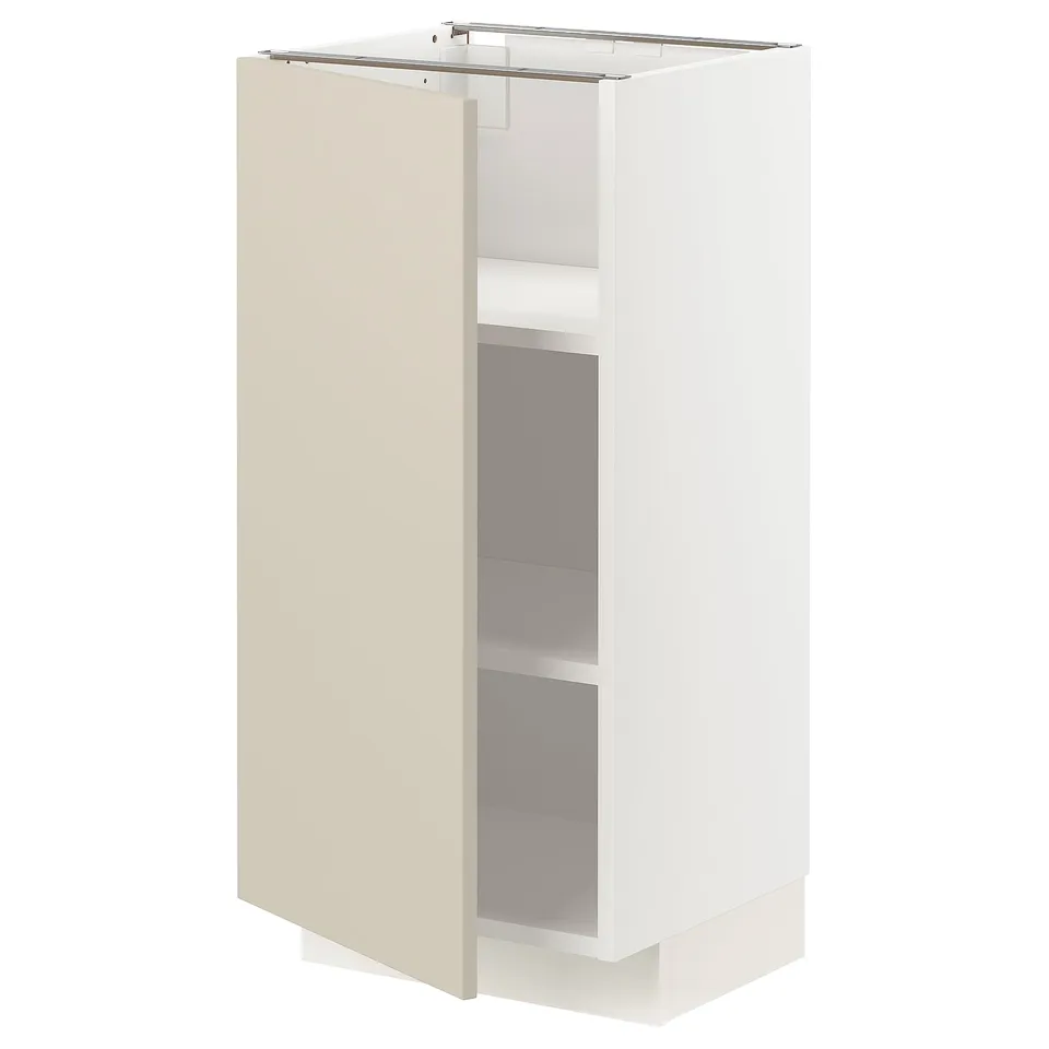 A beige and white METOD storage unit with a door and shelves inside. Its rectangular and has a modern, sleek design.