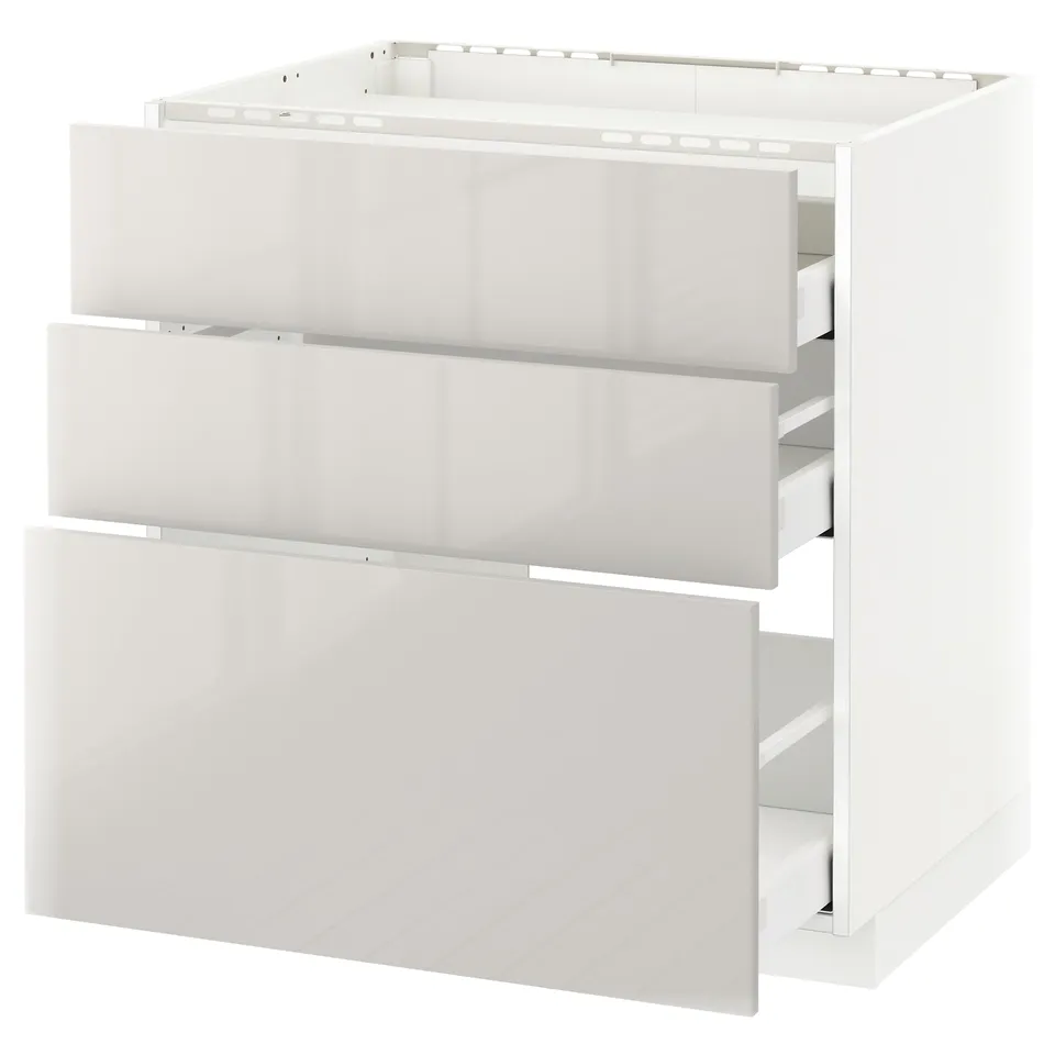 White METOD kitchen unit with three high-gloss grey drawers.