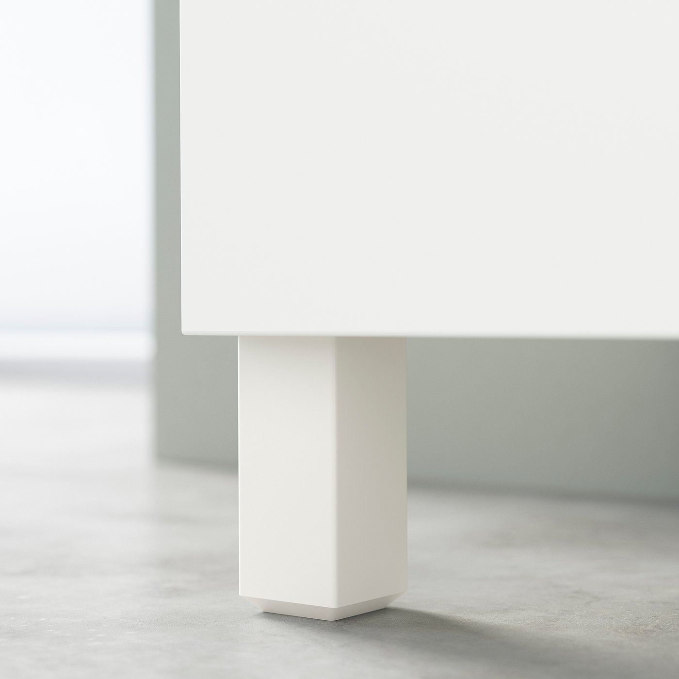 A white BESTÅ cabinet leg with a sleek, minimalist design. Its a modern piece of furniture made from steel.