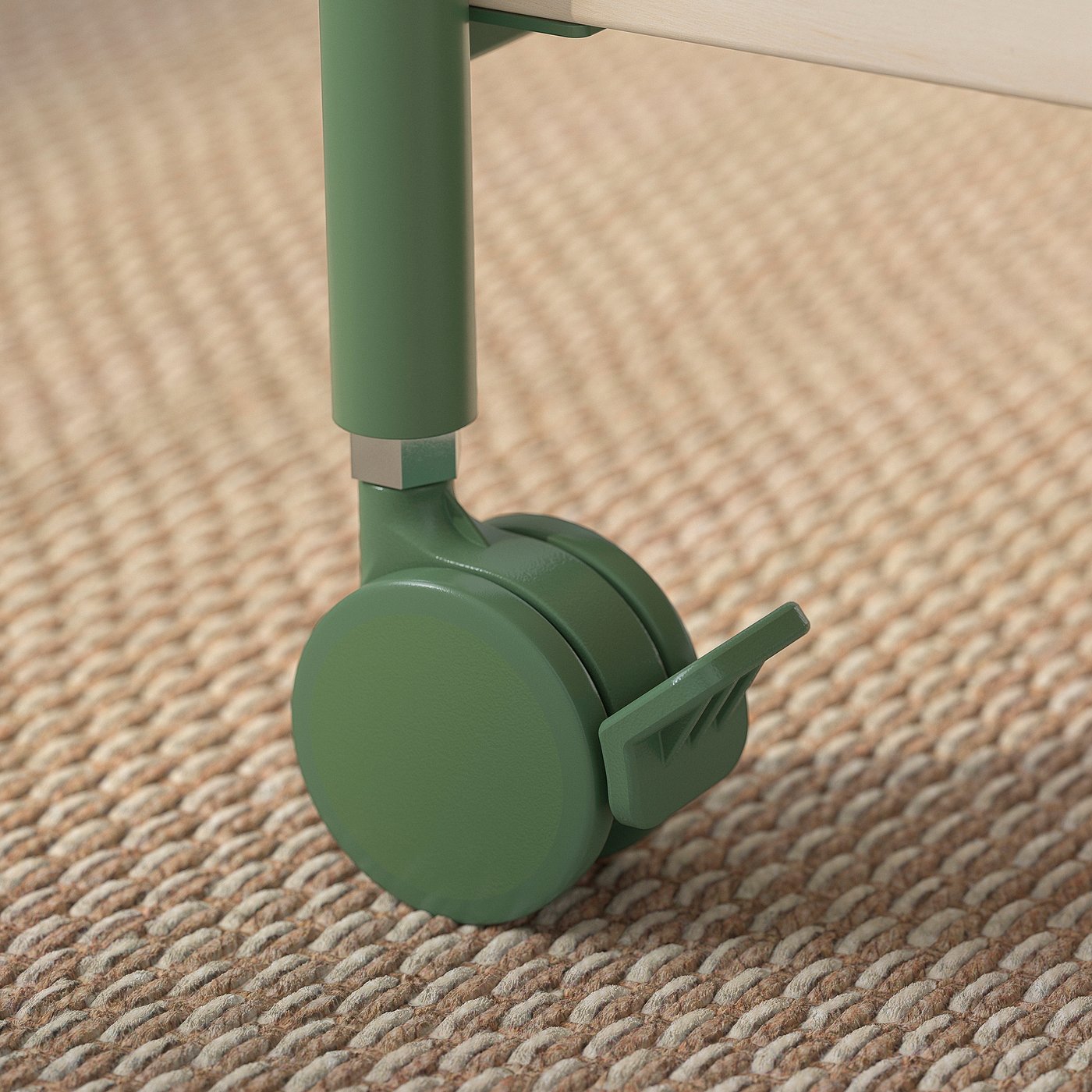 Close-up of a cabinets green castor wheel on woven beige carpet. Quality design with smooth, lockable caster for easy mobility.