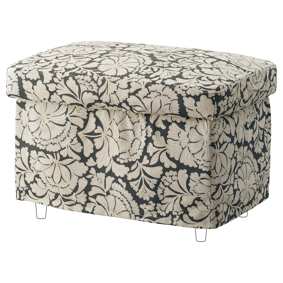 A STRANDMON footstool with a grey-black floral pattern, upholstered in cotton fabric.