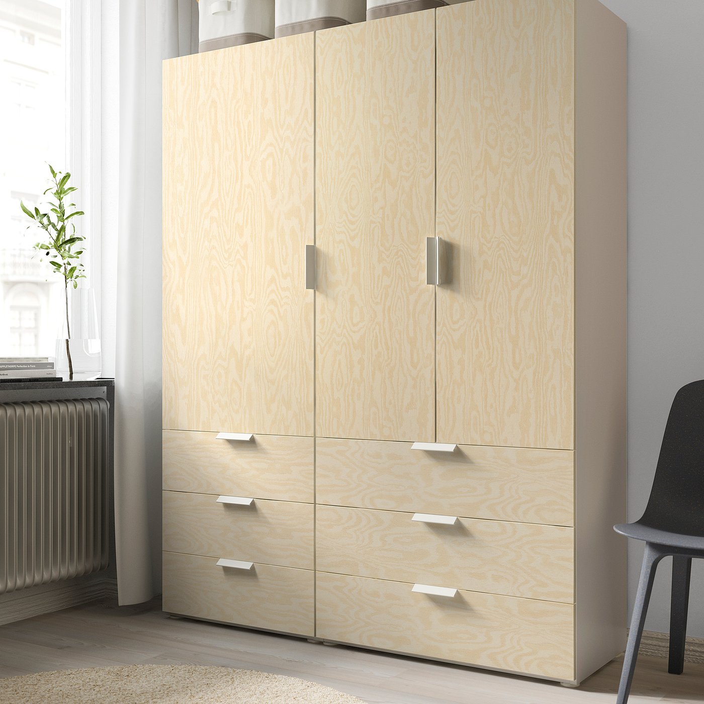 Light wooden wardrobe with four drawers and two doors, ideal for storage.