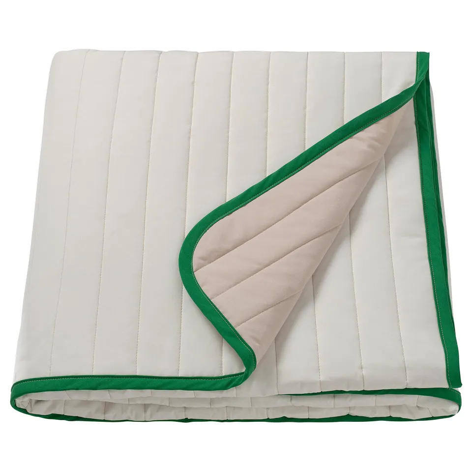 VETEJORDFLY bedspread, white/beige with green edge, rectangular, smooth design.