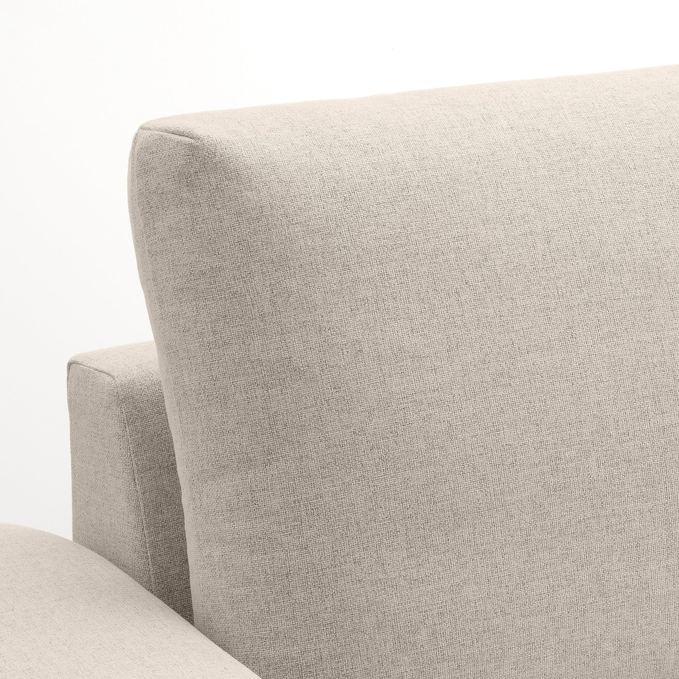 Sofas plush, light-colored cushion with smooth texture, designed for comfort.