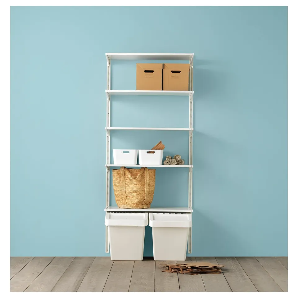 Shelves with drawers, boxes, basket, and bins against blue wall.