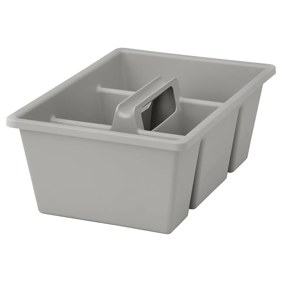 A light grey FÅNGGRÖDA drawer organiser with four compartments. Its made of recycled plastic and fits in boaxel and jonaxel mesh baskets.