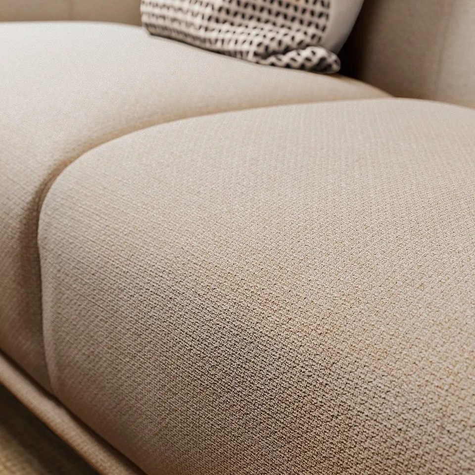 Beige, rounded sofa with soft fabric, part of VISKAFORS collection.