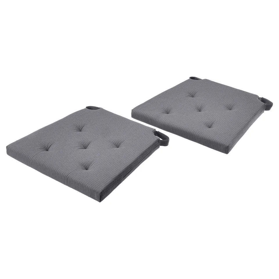 Two grey, rectangular chair cushions with tufted design and corner straps.