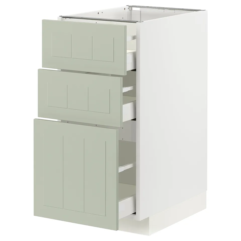 Modern kitchen unit with 3 light green drawers, white base, sleek and minimalist design.