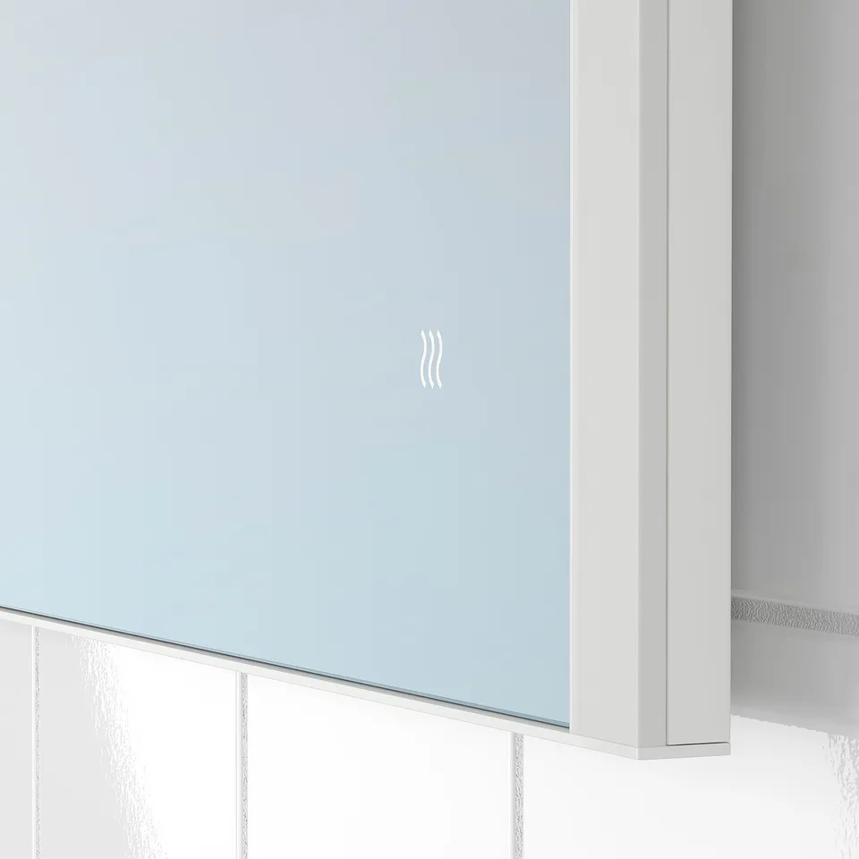 Modern mirror with built-in led lighting, anti-fog feature, and sleek design. Perfect for bathroom use, ensuring clarity and convenience.