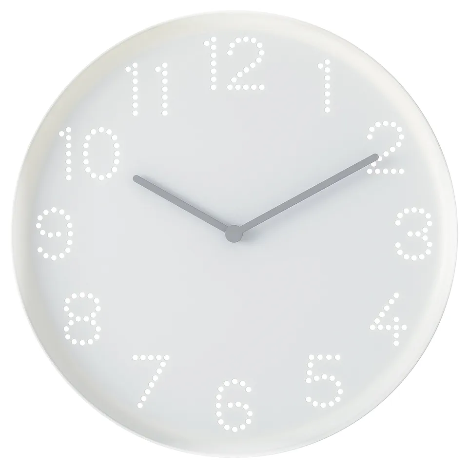 Round white wall clock with numbered holes, two hands, simple design.