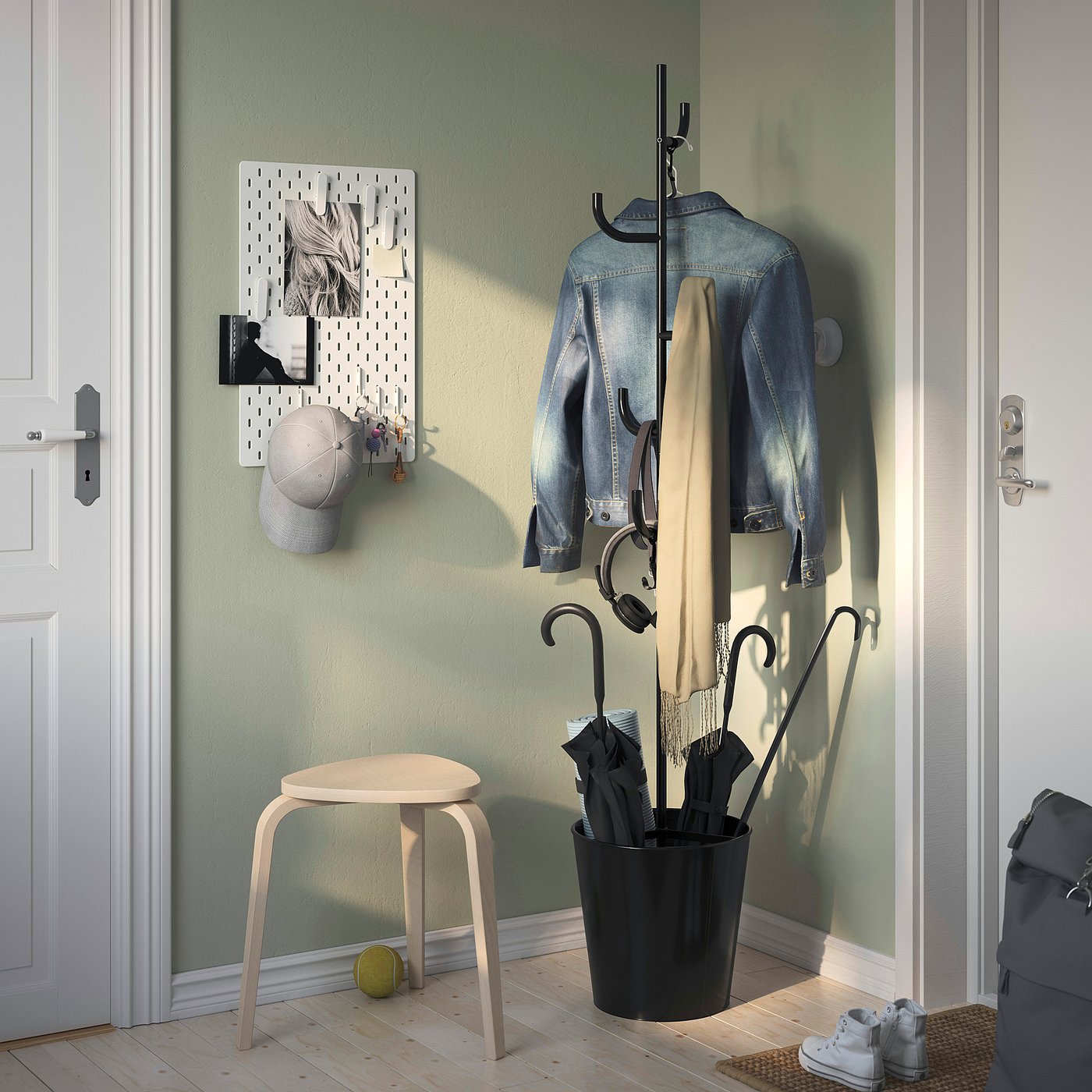 Black ÄLGANÄS coat stand with hooks and basket, near door, compact and stylish with decorations.