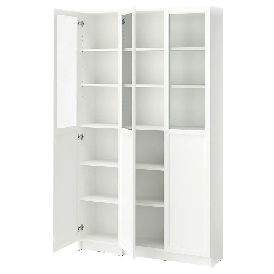 A white BILLY bookcase with glass doors, featuring multiple adjustable shelves for storage.