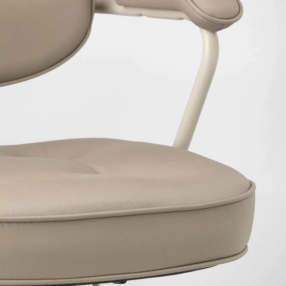 Modern office chair with beige leather seat and back, showcasing high-quality, ergonomic design.