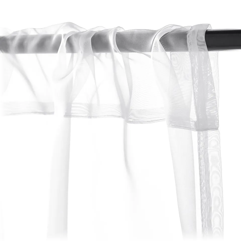 Transparent curtains with rod-pocket hanging, allowing daylight while providing privacy.