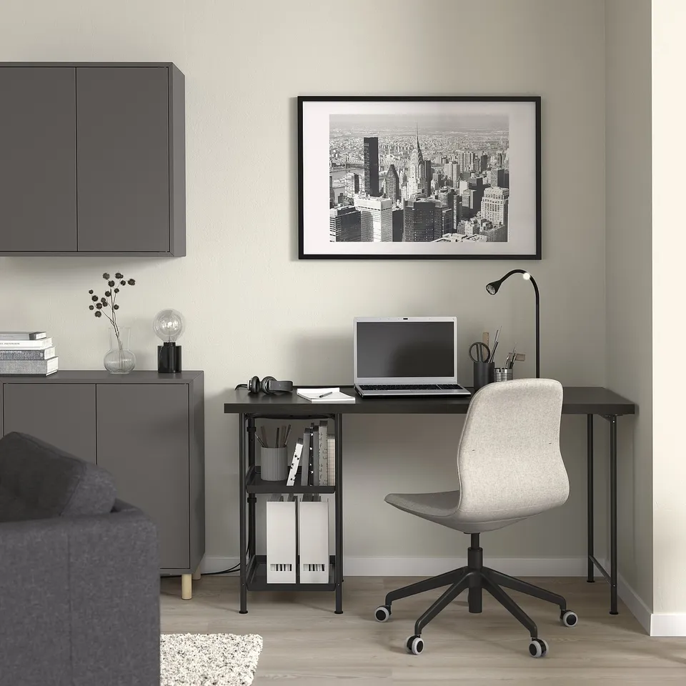 Modern home office with SPÄND desk, chair, and cityscape art.