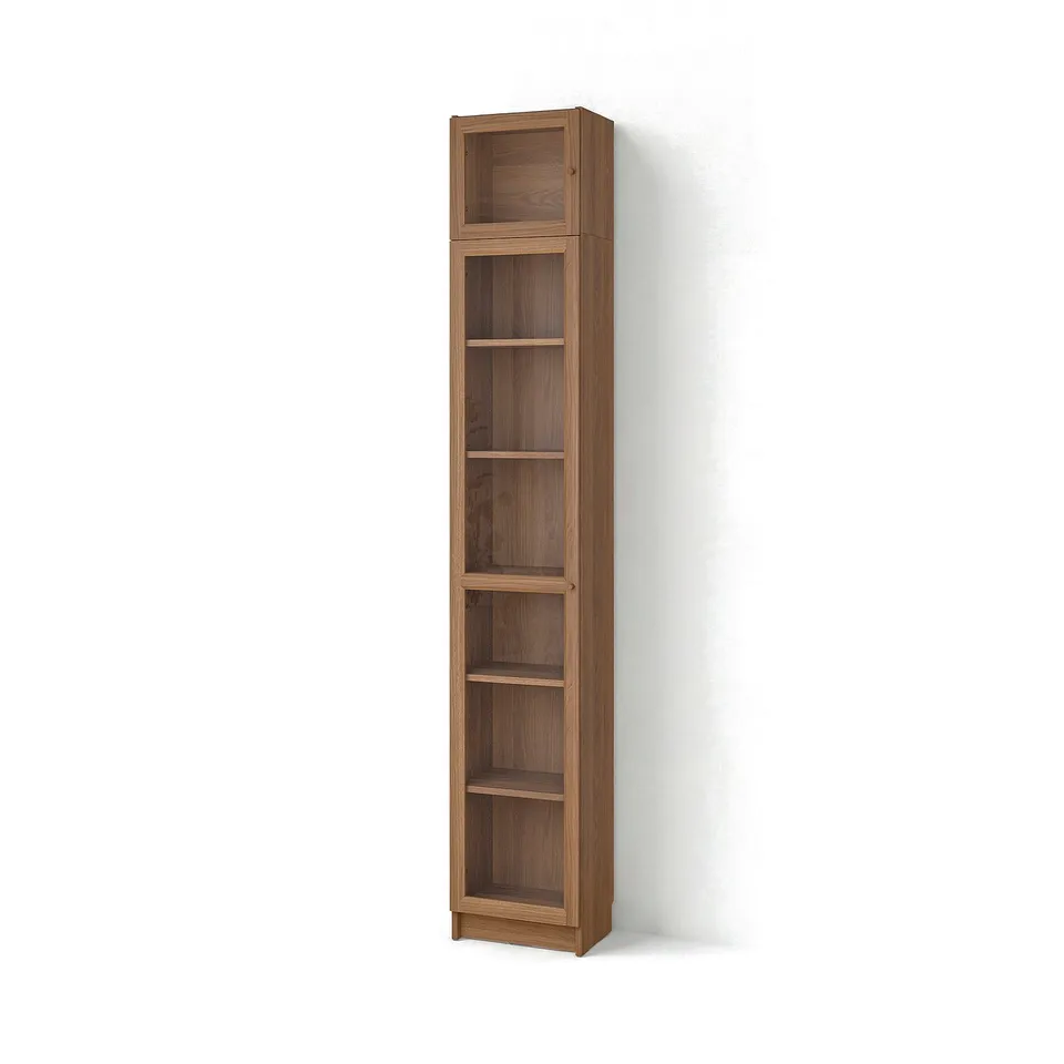 A BILLY bookcase, a tall wooden shelving unit with a natural finish, multiple adjustable shelves, and glass doors at the top.
