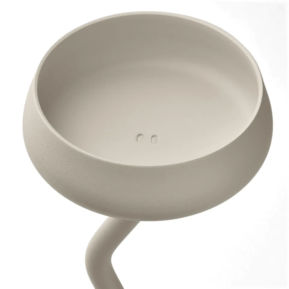 Modern candlestick with smooth, white, undulating stem and wide, shallow bowl. High-quality, elegant design.