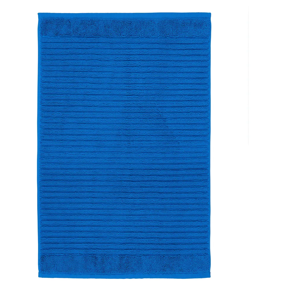Bright blue ALSTERN bath mat, rectangular, made of recycled cotton.
