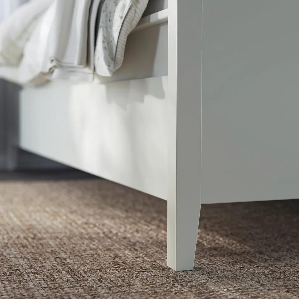 White IDANÄS bed frame with sleek, modern design soft-close storage drawers.